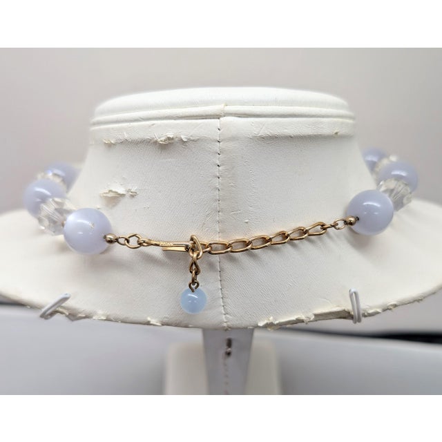 1950s goldtone single strand alternating spherical grey moonglow and clear cut glass beaded necklace with hook clasp....