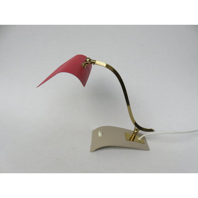 Unusual, minimalist table lamps from the 50s. The lamps can also be used as piano lamps. The lampshades are slightly...