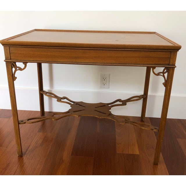 Beautiful Chippendale carved mahogany tea table with elaborate stretcher base. From Baker Furniture "Stately Homes"...