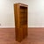 Vintage cherry display cabinet with hidden storage at the bottom and open shelves at the top. There are three removable or...