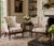 A handsome pair of Georgian Revival mahogany lounge chairs dating to the second quarter of the twentieth century....