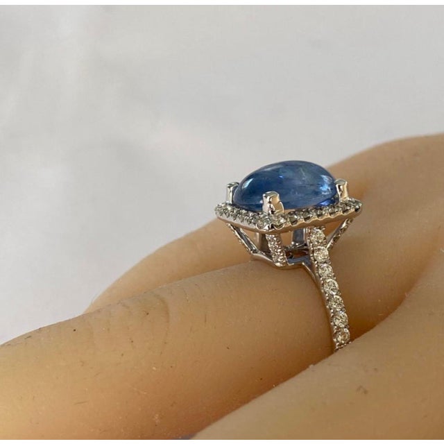 This breathtaking engagement ring showcases a magnificent GIA-certified no-heat Ceylon sapphire of 6.46 carats (GIA...