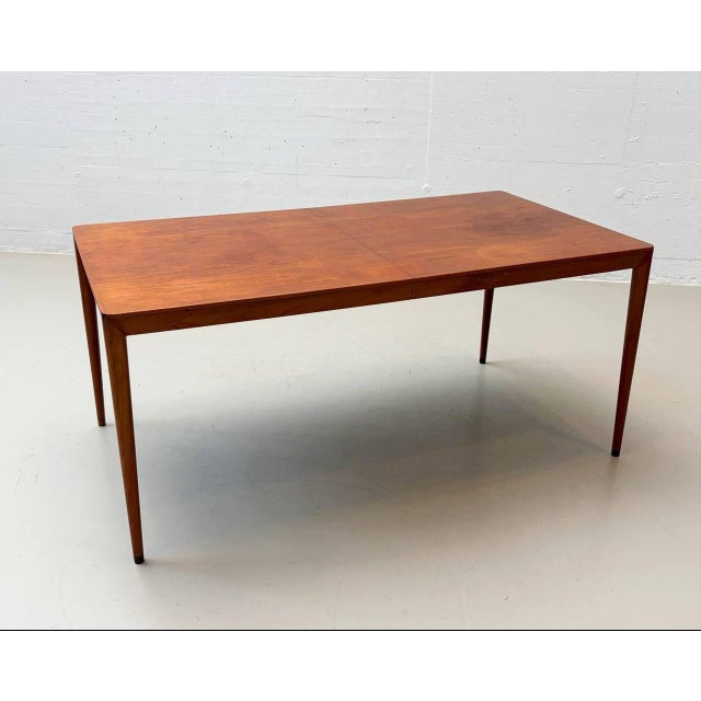 Elegant Danish dining table made of solid teak, designed by Erik Riisager Hansen and manufactured in the 1960s by Haslev...