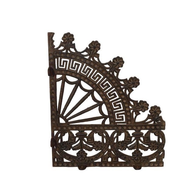 This pair of antique wrought iron architectural spandrels dates to approximately 1880, embodying the distinctive design...