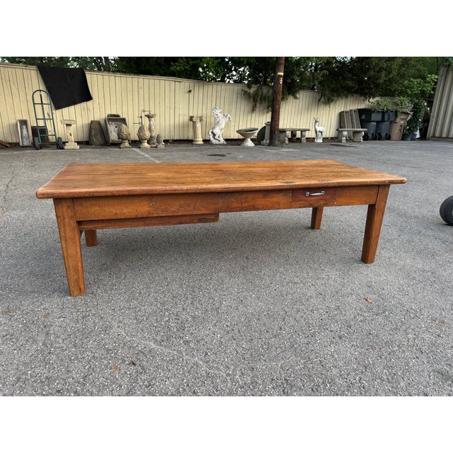 This 19th century coffee table has lovely character and patina! This piece is French country style with +a rough farm...