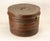 An outstanding antique hat box Circular metal container with unusual extra-large size Painted tin tole work with...
