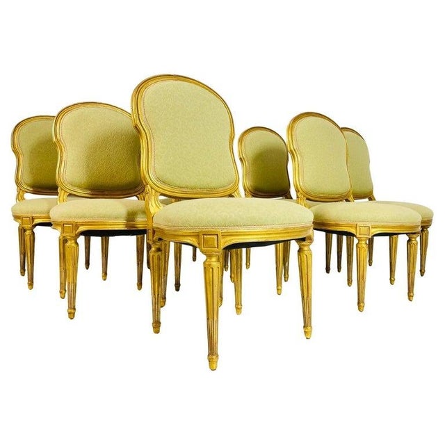 Set of 8 Dining Chairs in the Louis XVI Style designed and manufactured in Los Angeles, California by Dennis & Leen. The...