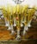 A spectacular collection of thirteen Baccarat Véga Flutissimo champagne flutes in Amber crystal. Designed by Savinel &...