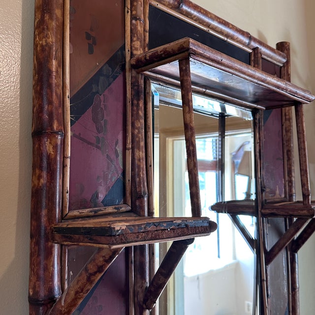 Antique Aesthetic Movement Bamboo Mirror with Shelves Victorian era wall mirror with three shelves and laquered panels. In...