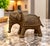 Beautiful vintage brass elephant figurine featuring exceptionally intricate detailing throughout. The body is covered in...