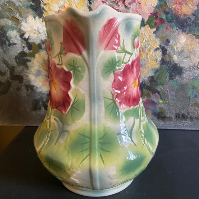This superb and colorful pitcher will find its place on a joyful and festive table. Hand painted. In excellent condition....