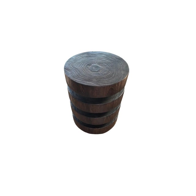 A wonderfully sculpted side table, crafted from a single block of teak wood. It features wonderful wood textures as well...