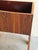 This sculptural vintage Danish planter stand is crafted in richly grained rosewood and showcases bold Mid Century Modern...
