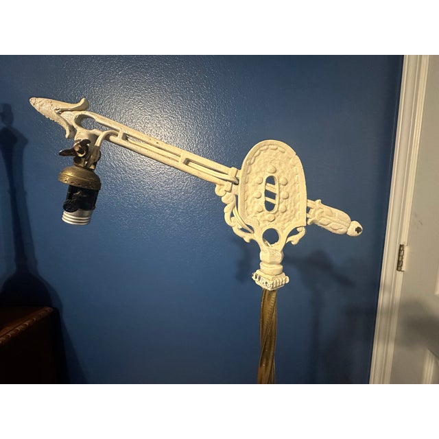 Step back in time with this exquisite 1920s wrought iron bridge lamp, a piece that combines the charm of yesteryear with...