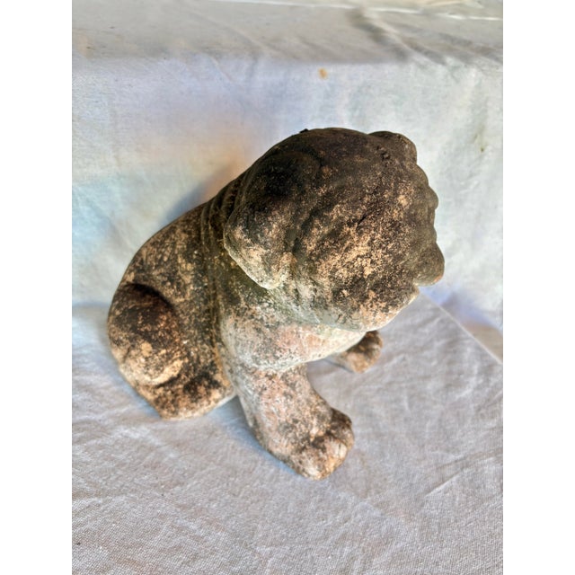 This Early 20th Century French Bulldog Garden Sculpture was crafted from terracotta in the early 1900's. The piece...