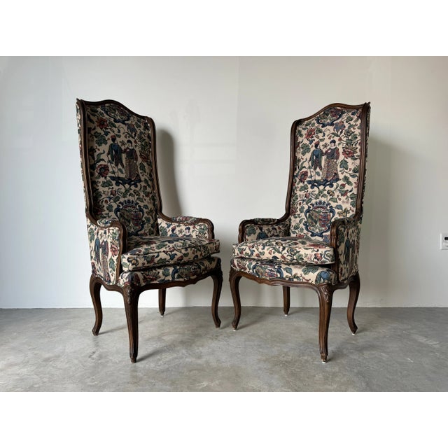 1960's Vintage Hollywood Regency Louis XV-Style High-Back Carved Wood Accent Chairs - A Pair This exquisite pair of...