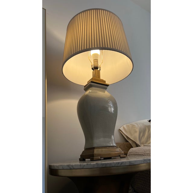 Elegant Port 68 table lamp featuring a classic urn silhouette in ivory porcelain with a beautiful crackle glaze finish....