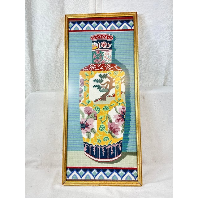 Bring a vibrant pop of color and texture to your walls with this gorgeous vintage framed needlepoint wall hanging. Hand...
