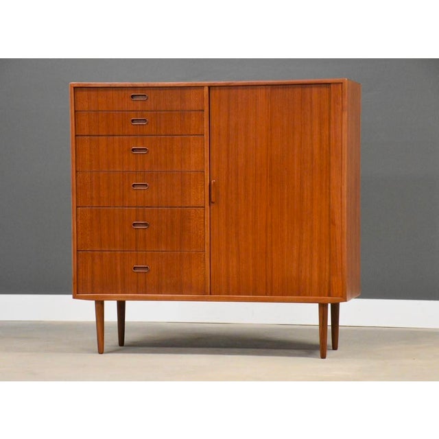 A mid century modern teak armoire dresser in the style of Svend Madsen for Falster. Made in Denmark. Circa 1960’s....