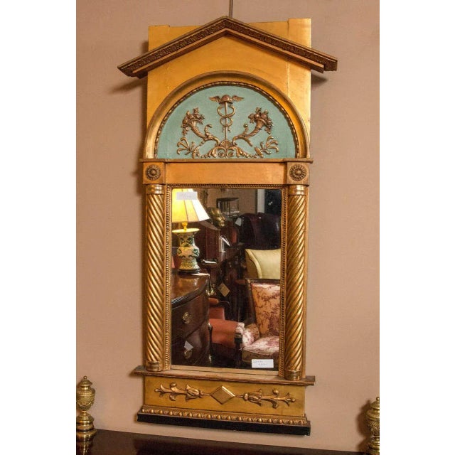 Italian Neoclassical Pier Mirror adorning a Caduceus amongst branches topped with flowering baskets along with roots and...