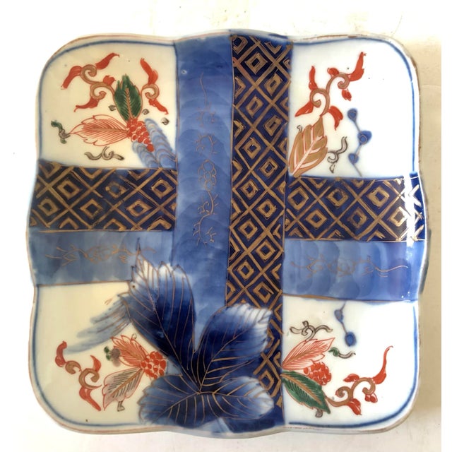 Stunning pair of Meiji period Japanese square plates. Crossed bands of what appear to represent embroidered panels...