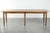 This large and relatively narrow antique French farmhouse dining table is made of pine and dates from the early 19th...