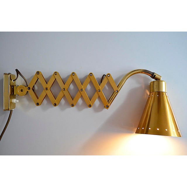 Mid-century diabolo scissor lamp in gold anodized aluminum - a design by karl lang for sis licht from the 1950s - the...