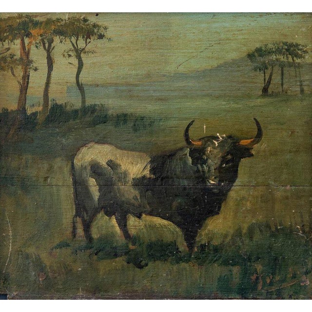 A French 19th-century oil painting on board depicting a Camargue bull set within a typical regional landscape of marshes,...