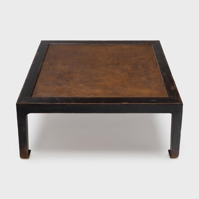 This woven-top table elevates the modern home as a statement coffee table with clean lines and rich textures. The square...