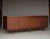 Rare high-quality sideboard/credenza, Italian design from the 1960s. It has four hinged doors and, inside, a large...
