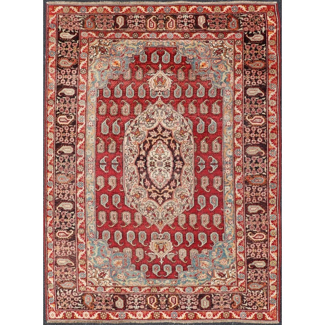 Measures: 5'10 x 8'2. Antique Turkish Rug with Rich Crimson, Sky Blue, and Ivory Accents 5'10 x 8'2. Keivan Woven Arts/...