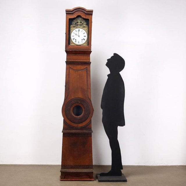 Pendulum clock in lacquered fir painted with floral motifs, embossed sheet metal face with neoclassical and gilded motifs....