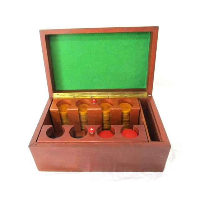 An Art Deco styled gaming set with walnut inlay to the top edge and inside two chip holders with 86 honey colored, 28...