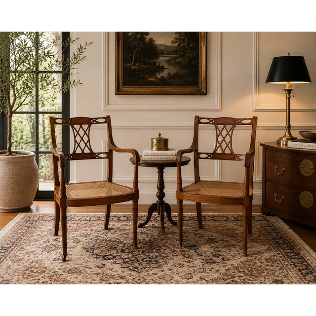 This elegant pair of mid-20th century Regency-style chairs embodies timeless sophistication and classic design. Crafted...