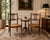This elegant pair of mid-20th century Regency-style chairs embodies timeless sophistication and classic design. Crafted...