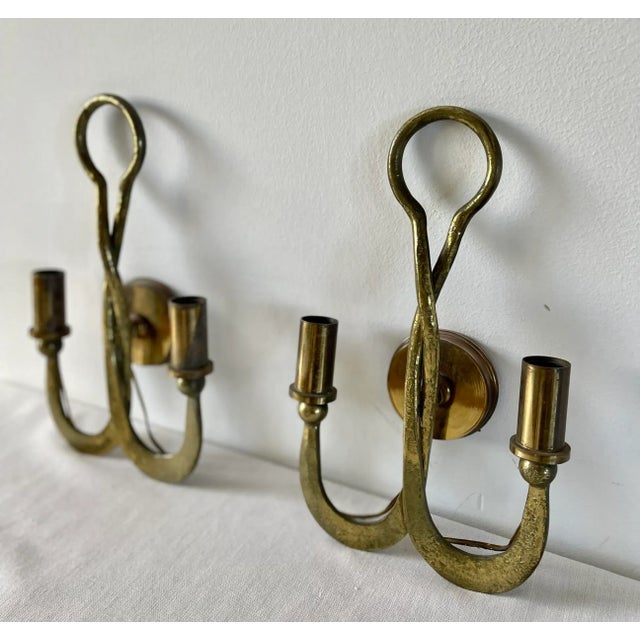 Pair of bronze sconces in the brutalist style. These two hammered sconces are the representation of the mixture of the...