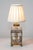 This exquisite 19th-century French lamp showcases exceptional craftsmanship and artistic elegance. The lamp features a...