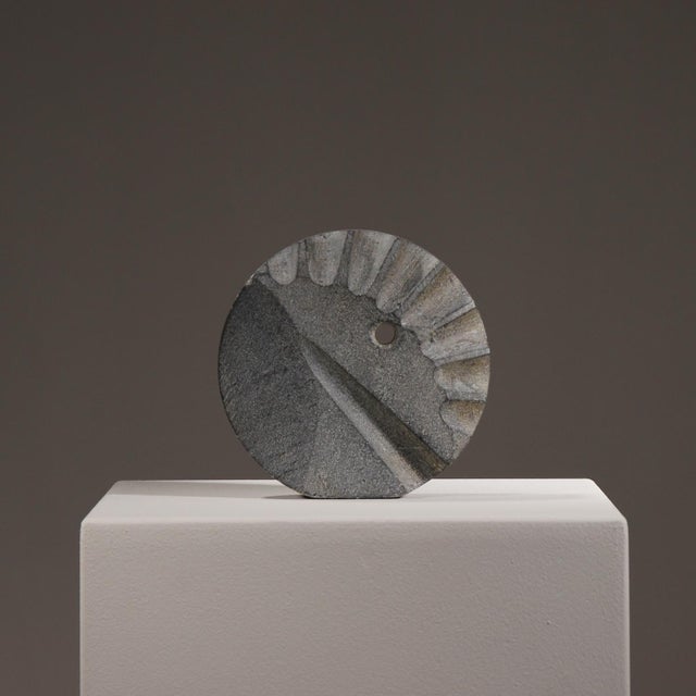 For sale is an extraordinary, abstract stone sculpture. This handcrafted art piece features a geometric-organic disc shape...