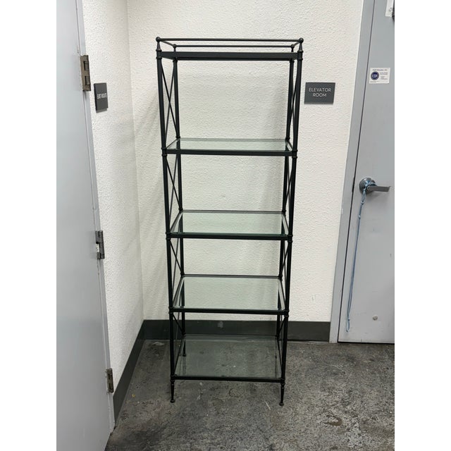 Design Plus Gallery presents the Glass Etagere Display from Restoration Hardware. This etagere has a black metal frame...