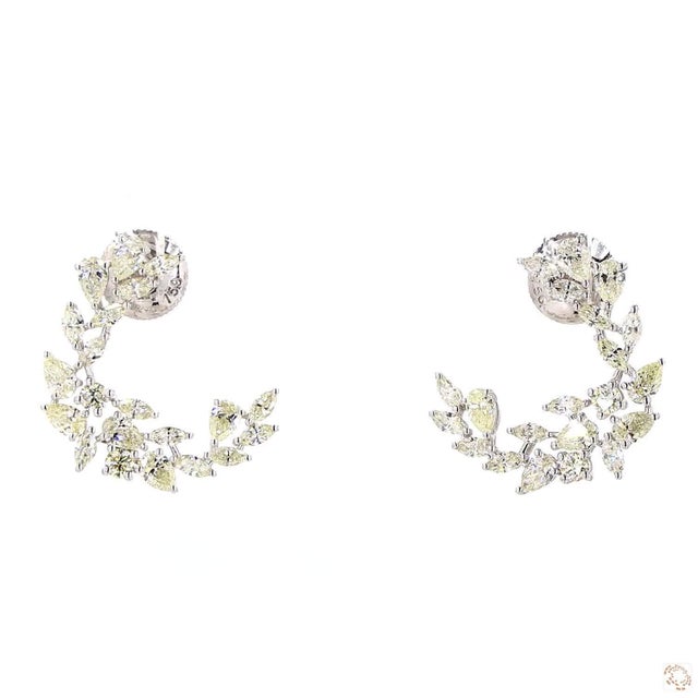 This pair of drop earrings from our contemporary estate collection centers on a 0.24-carat diamond in a round brilliant...