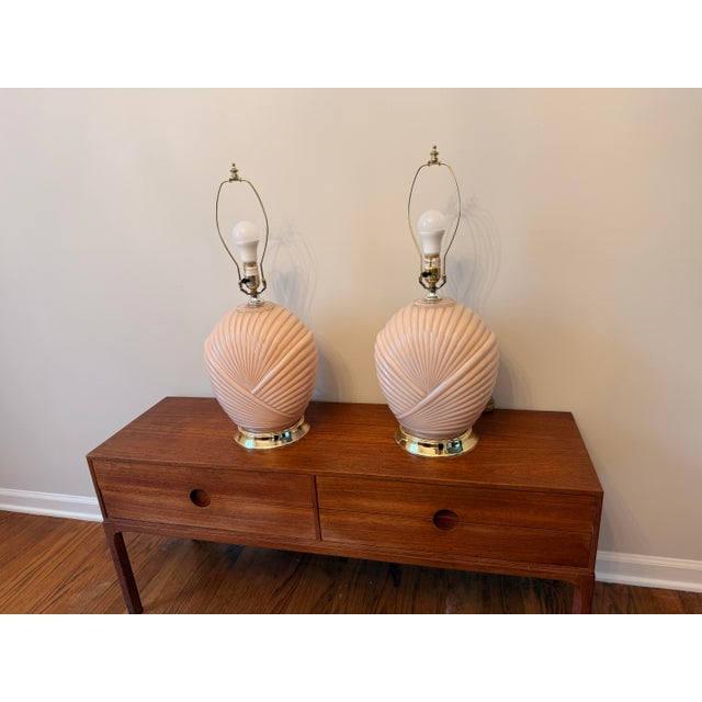 Elevate your space with this exquisite pair of postmodern 1980s table lamps, featuring a sculptural seashell motif....