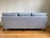 This vintage Baker sofa has been newly re-upholstered in Thibaut fabric. The piece features all new fabric and cambric,...