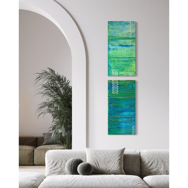 A tall, narrow two-panel diptych carries deep teal and emerald tones from top to bottom, the color built in enough...