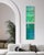 A tall, narrow two-panel diptych carries deep teal and emerald tones from top to bottom, the color built in enough...