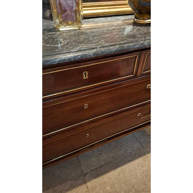 Louis XVI period mahogany commode with a marble top in perfect condition. This commode has been restored by a...