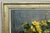 A charming Vintage French signed oil painting depicting a still-life arrangement of vibrant yellow flowers and rich green...