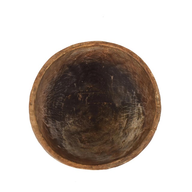 Add an authentic African touch to your kitchen with our Nupe Wood Bowl from Nigeria. This beautifully crafted bowl is not...