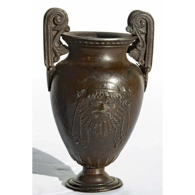 Pair of Roman classical two handled urns. Patinated cast iron. Mid 19th century grand tour.