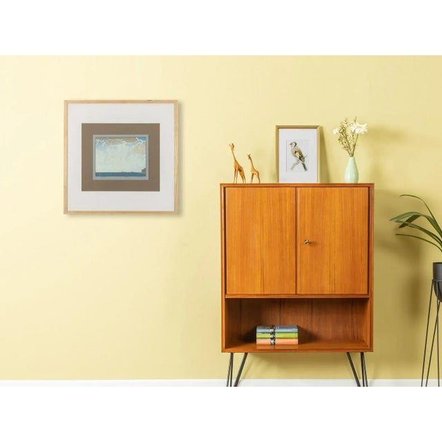 Coastal landscape with cloudy sky and freighters on the horizon in blue. Signed and dated color serigraph on thick paper...