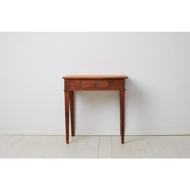 Small antique Swedish country house table in gustavian style with a drawer. The drawer has the original drawer pull in...